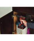 Person using 20V Max Cordless Drill Driver Kit With Battery And Charger Includes Double Ended Bit Lightweight 3.15 Lbs 11 Position Clutch For Precision 0 To 650 RPM Delivers 115 Lbs Of Torque For Wood Metal Plastic Projects Your Go To Power Tool on a cabinet hinge