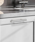 Set Of 25 Brushed Nickel Stainless Steel Cabinet Handles 2-1/2 Inch Center To Center 4 Inch Overall Length Modern Euro Style T Bar Pulls installed on white cabinet