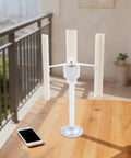 Vertical Axis Wind Turbine Kit 12V 40W With 3 Phase Permanent Magnet Motor on table near phone