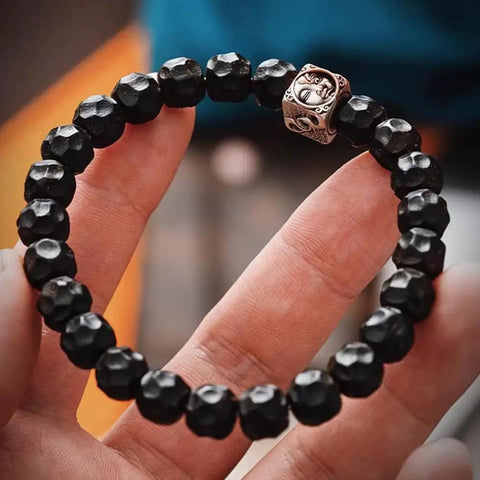 Premium Tibetan Style Spacer Beads For Bracelets And Necklaces Diy Jewelry Crafting Supplies, black 9.5mm beads on a hand.