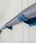 Premium Rockler Dust Right 4 Inch Hose Cradles holding rigid vacuum hose on wall, featuring sturdy ABS clamps for efficient ventilation.