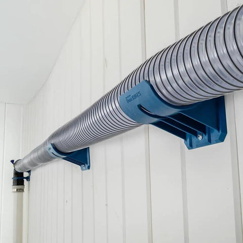 Premium Rockler Dust Right 4 Inch Hose Cradles holding rigid vacuum hose on wall, featuring sturdy ABS clamps for efficient ventilation.