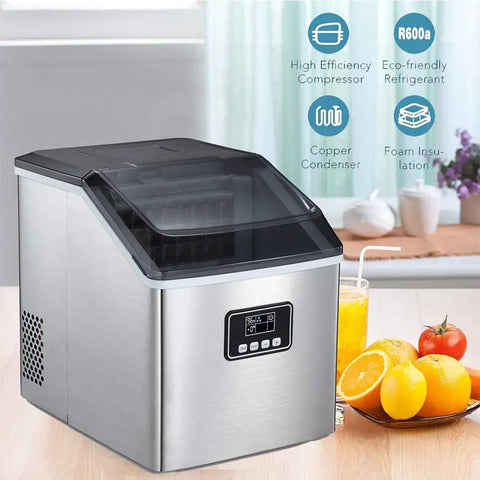Portable Automatic Countertop Ice Cube Maker Cranks Out Forty Eight Pounds Daily With Quick Ten Minute Rounds Self Clean Design Saves Effort While You Fuel Yard Gatherings Or Super Bowl Watch Parties Silver Trim beside fresh fruit and drinks.