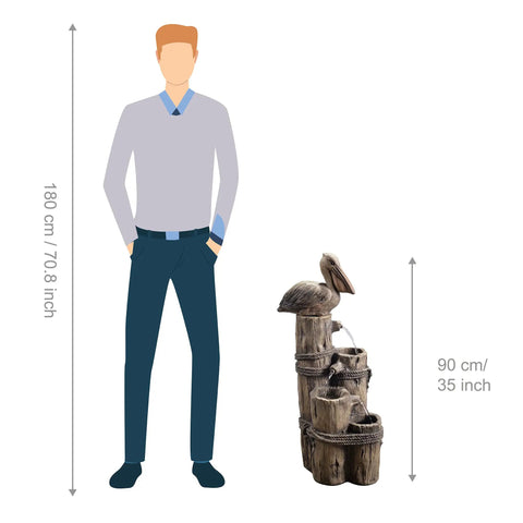 Chill Four Tier Pelican And Driftwood Outdoor Cascading Water Fountain next to figure for size reference, brown resin, 90 cm tall