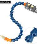 Mist coolant spray system for CNC machines; blue articulated tubing with orange fittings and brass nozzle.