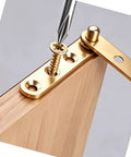 2 Pack Concealed Pivot Hinge for Windows and Doors, Brass Gold Hidden Cabinet Rotating Hinge being installed on wood