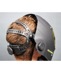 Side view of Sentinel A50 Welding Helmet on a person, featuring low-profile black shell and adjustable Halo headgear