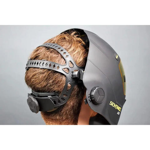 Side view of Sentinel A50 Welding Helmet on a person, featuring low-profile black shell and adjustable Halo headgear