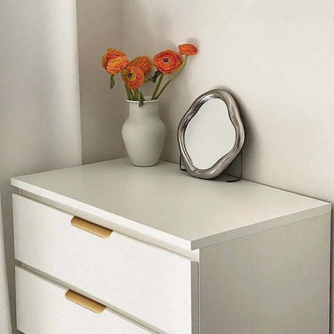 Gold Adhesive Edge Finger Pulls For Cabinets 5 Pack With Screws And Tape installed on white drawer in living room setting