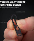 Close-up of Two Pack Heavy Duty Titanium Zipper Pull Replacements For Backpacks Luggage Jackets And Outdoor Gear, black, held by hand.