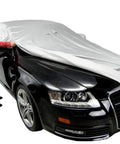 Heavy Duty All Weather Car Cover Gonna Shield Your Tesla Model S Like Armor While Crushing Rain Snow And UV Damage Through Super Breathable Water Repellent Material Made For Rough Daily Use being applied to a black sedan.