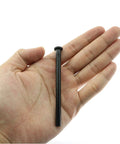Black metal door hinge pin, 3.5 inches long, shown held in a hand.
