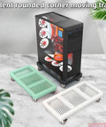 Mobile Heavy Duty Rolling Computer Tower Stand With Lockable Swivel Casters And Smart Cooling For Slick Under Desk Moves Secure Pro Black Steel Desktop Rig Cart with green and white trays.