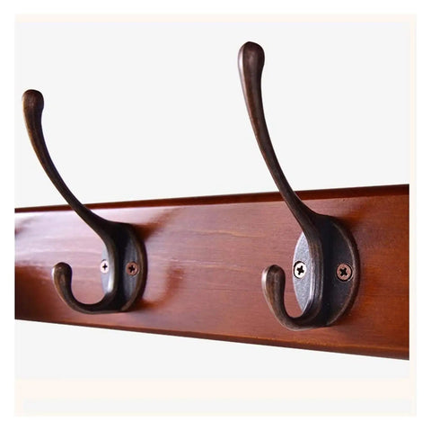 Close-up of Heavy Duty Wall Mounted Coat Hooks Rack with bronze hooks on wooden shelf, perfect for securing coats and hats.