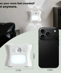 Motion Sensor Light Indoor with Remote, Rechargeable Wireless LED Sconce on wall with phone for size reference.