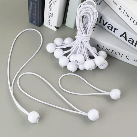 Go To 30 Pack Ball Bungee Cords For Camping And Canopy Tarp Shelter Includes 6, 9, And 12 Inch Cords with books in background.