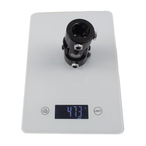 One Inch Double D Steering Universal Joint Shaft Black 83mm Long U Joint on digital scale showing 473g