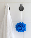 2 Pack Matte Black Wall Mount Towel Hooks Set Heavy Duty Robe Coat Hooks Holder For Bathroom Kitchen Garage Home Office Cabinet Hotel Decor And Laundry Room Organization, with white towel and blue loofah hanging on tile wall.