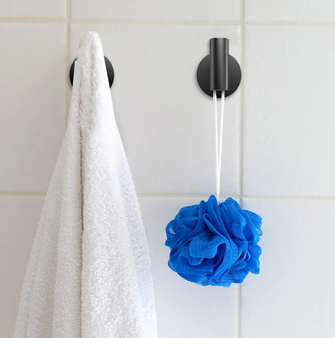2 Pack Matte Black Wall Mount Towel Hooks Set Heavy Duty Robe Coat Hooks Holder For Bathroom Kitchen Garage Home Office Cabinet Hotel Decor And Laundry Room Organization, with white towel and blue loofah hanging on tile wall.