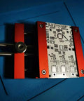 Beefy Heavy Duty Welding Fixture For PCB Circuit Boards With Aluminum Alloy Clamp in red finish, holding a circuit board