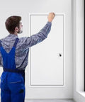 Man inspecting Heavy Duty Aluminum Access Door With Rust Proof Honeycomb Core For Drywall Attic And Outdoor Kitchen Plumbing Inspection Hatch Panel In Crisp White.