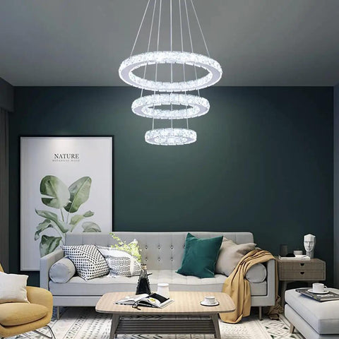 Modern LED Crystal Chandelier With 3 Ring Pendant Lights Adjustable Stainless Steel Ceiling Fixture in living room setting