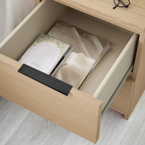 Matte Black Edge Finger Pulls 10 Pack, Concealed Drawer Handles on wooden cabinet drawer, showing modern design in use.