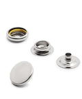 Close-up of Heavy Duty Snaps And Tool Kit With Sixty Sets Of Five Eighth Inch Nickel Post And Stud Fasteners And Hand Tools For Sewing