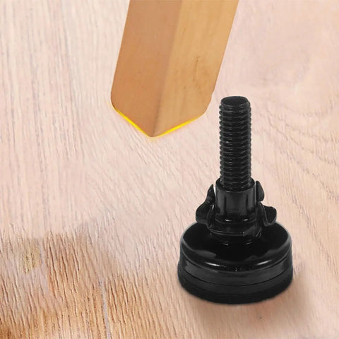 Adjustable Furniture Support Legs Set For Sofa Cabinet And Table, black plastic foot nearing wooden leg on light surface