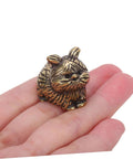 Person holding a cat shaped brass cabinet knob from Cat Shaped Brass Cabinet Knobs Set For Kitchen Bedroom And Bath, Dope Vintage Animal Drawer Handles.
