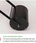 Cover soil repression wheel part of Handheld Manual Garden Seeder With Seven Port Seed Dispenser, black cylindrical accessory