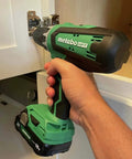 Person using Go-To 18V Cordless Drill Driver Kit With 1/2-Inch Keyless Chuck on cabinet hinge