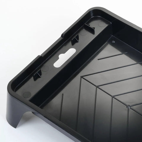 Close-up of black 4 Inch Paint Tray Pan from 12 Pack with dual wells for rollers, featuring textured surface and spill-resistant design.