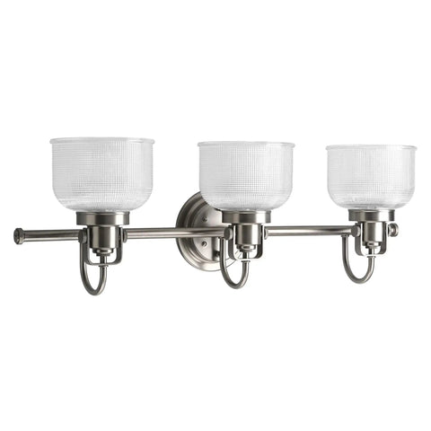 Archie Collection 3-Light Bath Vanity Light With Double Prismatic Glass in Antique Nickel mounted, front view.