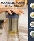 BPA-Free Reusable Oil And Butter Filter Press With Plunger And Brush in use, straining oil into a wide-mouth jar, 75-micron stainless mesh