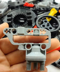 Close-up of parts from Technical Car Suspension Building Kit With 144 Pieces Including Wheels Connectors Shock Absorbers Turntable