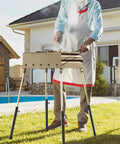 Four Piece Top Tier Folding Table Leg Extenders With Adjustable Heights From Three To Thirteen Inches Crafted From Solid Rust Proof Steel To Elevate Your Setup Kick Lower Back Strain Away And Keep Your Gear Dope For Indoor Or Outdoor Use Daily in use during outdoor grilling.