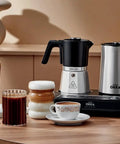 Dope All In One Turkish Coffee And Moka Pot With Milk Frother, Dual Brew Machine, chrome finish, displayed on a kitchen countertop