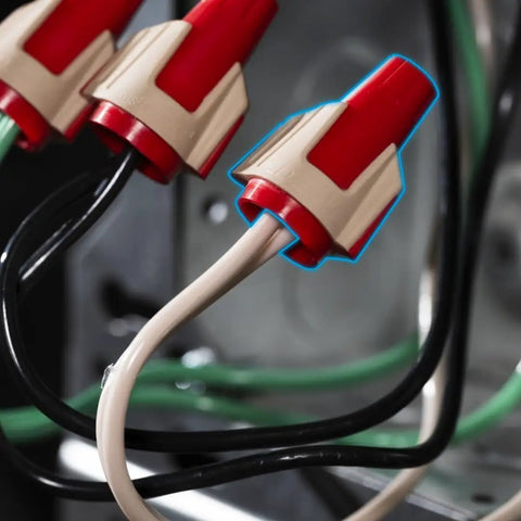 Close-up of Twister Pro Wire Connectors in use with red SureGrip overmold, demonstrating easy connection with wires.