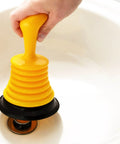 Mini Bellows Sink Plunger 11 Inch for kitchen and bathroom sinks in action, heavy duty clog remover with ergonomic handle on a sink