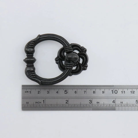 Antique Bronze Ring Pull Handle with ruler for size comparison, part of Antique Bronze Ring Pull Handles Set Of Four For Cabinets And Drawers Vintage Style Cabinet Pulls With Screws Included Durable Metal Construction Smooth Classic Ring Design Easy To Install Enhances Kitchen And Furniture Decor