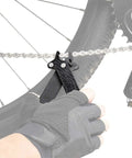 Cyclist using Power Lever X 5-In-1 Master Link Pliers And Tire Levers With Chain Hook Presta Core Tool on bike chain