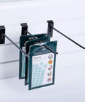 100 Pack Black Slatwall Hooks 10 Inch Long Heavy Duty Iron Slatwall Panel Hangers installed displaying items