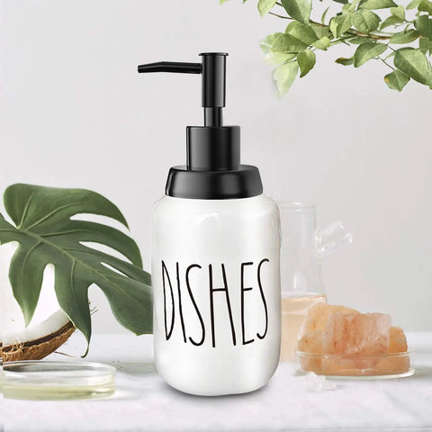 Farmhouse Ceramic Soap Dispenser With White Glaze, Bold Black Pump And Lettering, 14oz, Perfect For Kitchen Counter Or Sink, Bathroom Decor, Smudge Resistant Porcelain Build Stays Clean And Stylish on counter with plants
