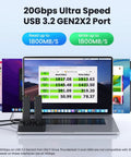 Dual Bay M.2 NVMe SSD Cloner Dock and Enclosure With USB 3.2 Gen 2X2 boasting 20gbps speeds connected to a laptop displaying speed test results.