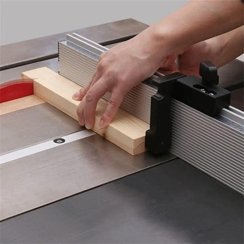 Rock Solid Aluminum Miter Gauge With Sleek Track Stop And Wide Adjustable Fence For Table Saws And Router Tables in use, guiding a wood piece.
