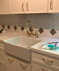 Kitchen with unlacquered solid brass cabinet pull and knob set on drawers and doors, modern serene style, 7-inch length.