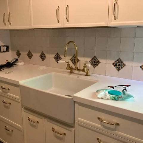 Kitchen with unlacquered solid brass cabinet pull and knob set on drawers and doors, modern serene style, 7-inch length.