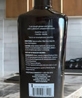 Back label of Daily Stone Cleaner Spray For Granite, Marble And Quartz With Peppermint Sage Scent, 16 oz on kitchen counter