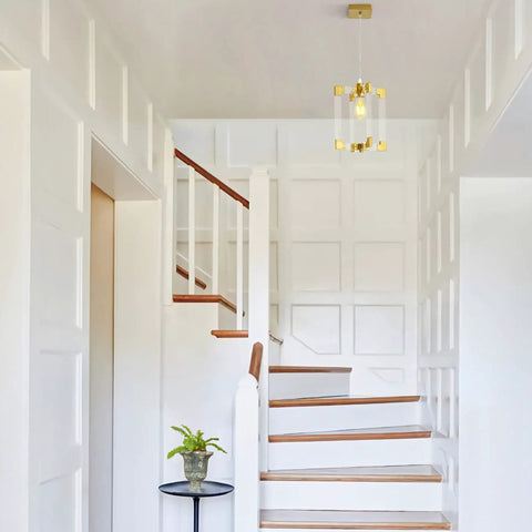 Gold Pendant Light Fixture With Brushed Brass Finish, 1 Light Modern Linear Chandelier in stairway with white paneled walls